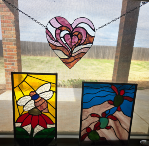 heart, bee, and turtle stained glass art